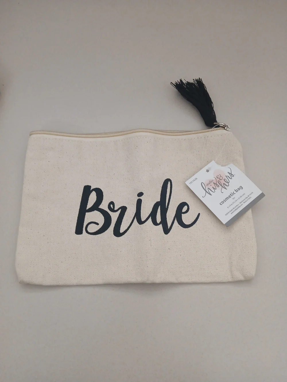 Shiraleah Cream Canvas Pouch with Gold Script and Pom Pom